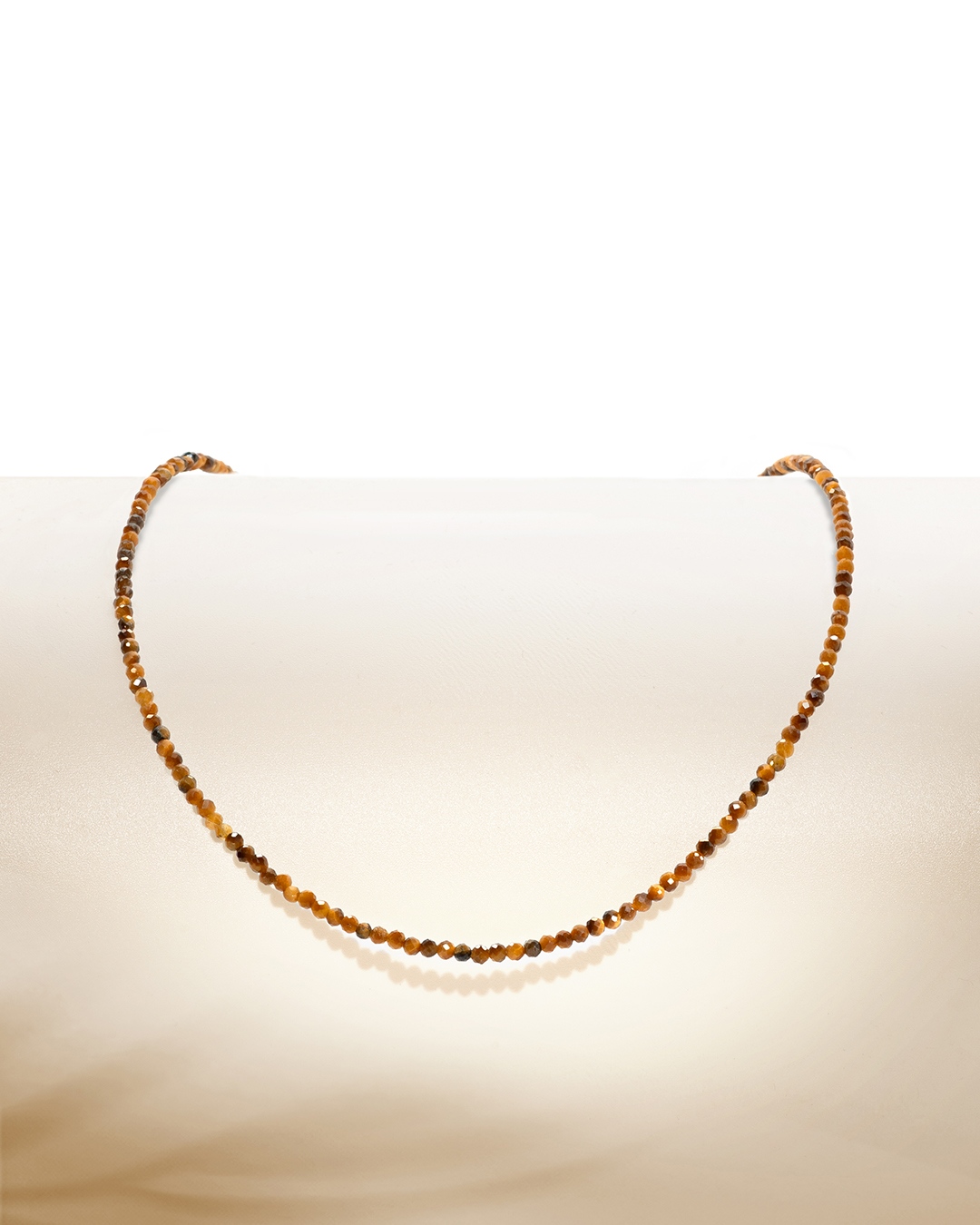 Packshot Pendentif Oeil de tigre Messi